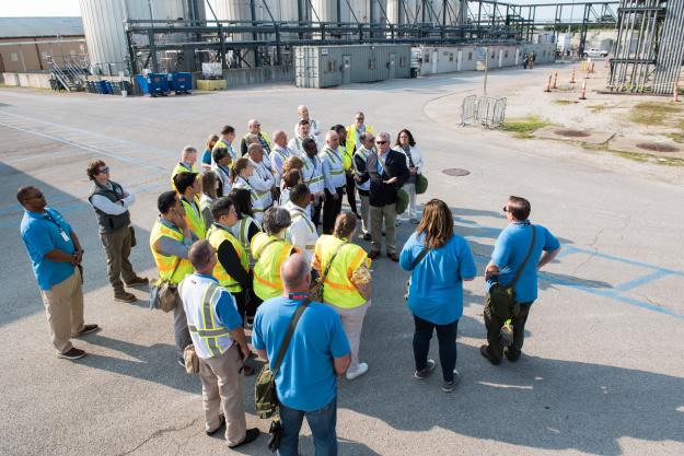 Mike Noyes (second from top left), Bechtel Parsons Blue Grass plant manager, provides an overview of the Blue Grass Chemical Agent-Destruction Pilot Plant during the Organisation for the Prohibition of Chemical Weapons Executive Council visit June 13. 
