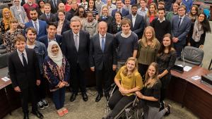 OPCW Director-General Ahmet Üzümcü (center) with students from World Class The Hague during their visit to OPCW Headquarters on 19 October 2017.