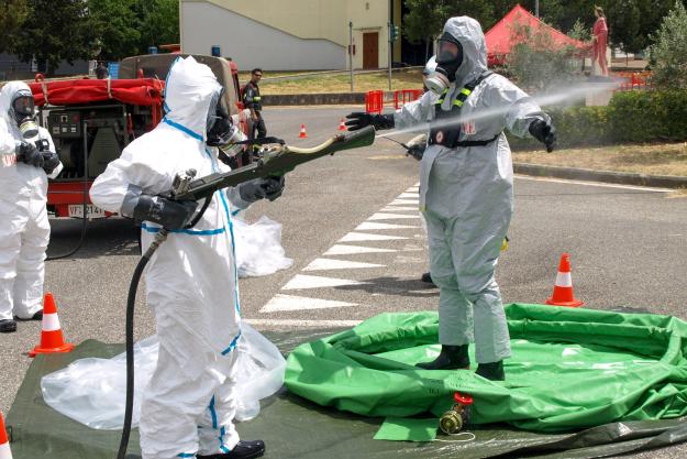 Participant practices decontaminating investigator who has exited the crime scene.