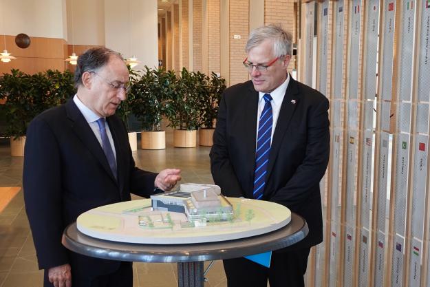 OPCW Director-General, H.E. Mr Fernando Arias shows H.E. Naor Gilon, Ambassador of Israel to the Netherlands an architectural model of the future OPCW Centre for Chemistry and Technology