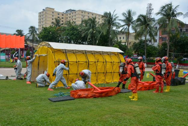 Mobile victim assistance station is assembled during simulated chemical attack.