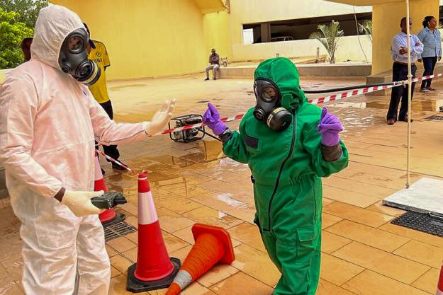 Exiting a mock decontamination station.