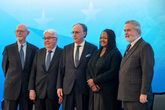 Guests pose for a photograph at the Assembled Chemical Weapons Alternatives (ACWA) End of Destruction Operations celebratory event at the U.S. Institute of Peace, Washington, D.C., Dec. 13.