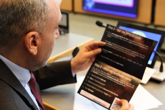 Participants engage in an interactive activity on the use of artificial intelligence in chemistry at the first Science for Diplomats event on the sidelines of Executive Council-111.