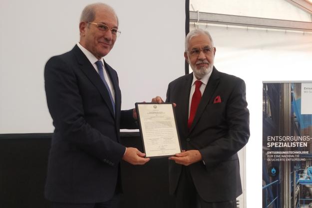 Director-General presents a certificate to the Libyan government in recognition of the complete destruction of all its declared chemical weapon stockpiles.