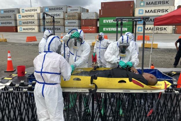Participants conduct victim decontamination procedures during the final exercise of the Integrated Advanced Course and Exercise for GRULAC in Panama.