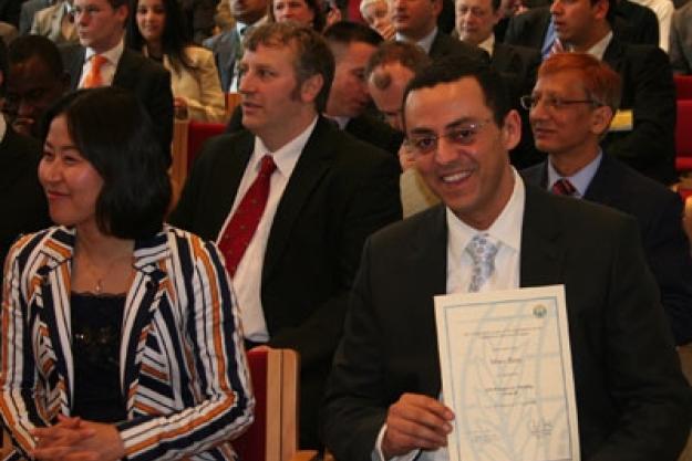 An inspector receives his graduation certificate. The 12-week eighth inspector training course conducted by the OPCW was completed on 11 April 2008 by 27 inspector trainees from 18 different nationalities.