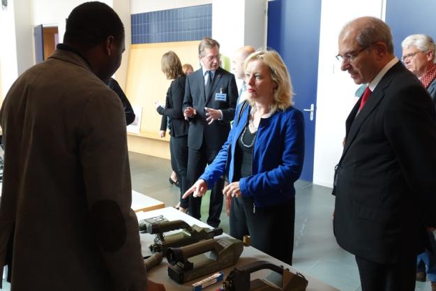 Minister of Education, Culture and Science of the Netherlands, Dr Jet Bussemaker (middle) and OPCW Director-General Ahmet Üzümcü examine chemical weapon inspection equipment.
