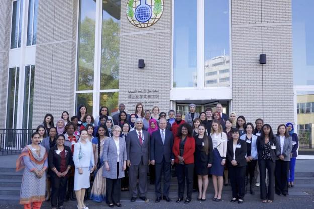 OPCW Director-General Ahmet Üzümcü and Deputy Director-General Hamid Ali Rao (both center) with participants at the Symposium on Women in Chemistry.