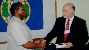 Mr. Mark Bor, Kenya's Permanent Secretary at the Ministry of Public Health and Sanitation, welcomes Mark Albon, OPCW's Head of Implementation Support.