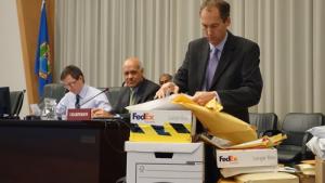 Herve Glemet, a budget officer at OPCW, opens the first tender for the destruction of Syrian chemicals.