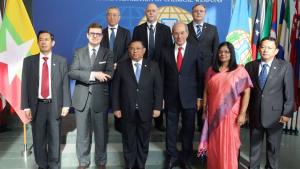 Myanmar’s Foreign Minister, Mr Wunna Maung Lwin (center) and members from the delegation of Myanmar with OPCW Executive Council Chairperson Francesco Azzarello of Italy (second from left), Director-General Ahmet Üzümcü (third from right), Deputy Director-General Mrs Grace Asirwatham (second from right) and members of OPCW senior management.