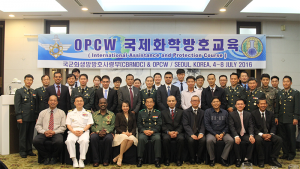 Participants at the Advanced Training Course for Police First Responders from Asia, which was held in Seoul, Republic of Korea from 4-8 July 2016.A course participant is checked for contamination as part of the training exercise for first responders. If this were a real event, both participants would be in protective gear.