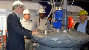 Participants listen to an explanation of a chemical process at the University of Surrey pilot plant