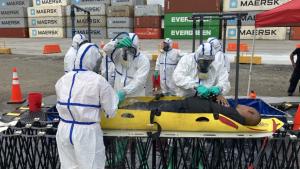 Participants conduct victim decontamination procedures during the final exercise of the Integrated Advanced Course and Exercise for GRULAC in Panama.
